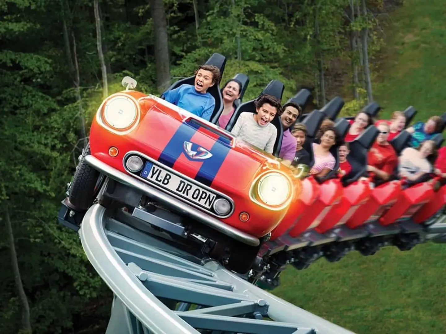 Teens and parents screaming on a coaster