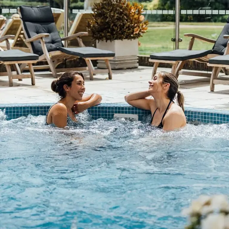 Adults relaxing in a hot tub